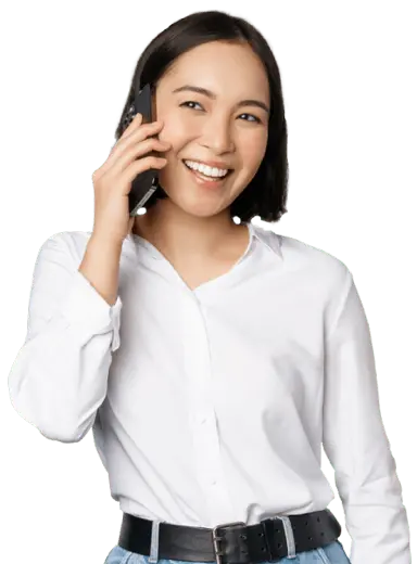 A girl dressed in white is using the affordable international calling service of Slickcall